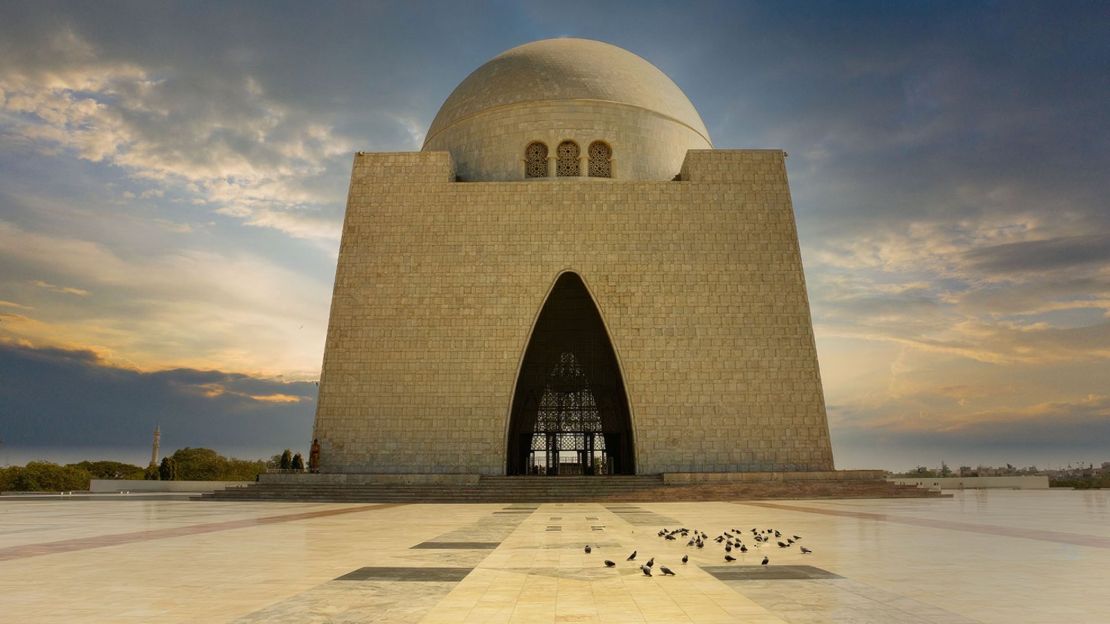 travel guide | destination | karachi | KHI | pakistan | Sunsets Warm Glow at the Mausoleum of MazareQuaid; Karachi; Pakistan-AdobeStock_772434422